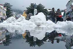 A part of Scandal Point reflected on the melting snow after heavy snowfall in Shimla 