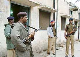 Security personnel man a polling booth on the eve of the Punjab Assembly elections in Ludhiana on Monday.