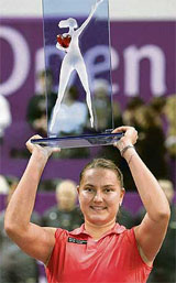 Russias Nadia Petrova lifts the trophy after defeating Czech Republics Lucie Safarova in the final of the WTA Gaz de France Tennis Open at Coubertin Stadium in Paris 