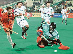 Maratha Warriors goalkeeper Gurpret Singh makes a save during the PHL match against Bangalore Lions at the Sector 42 Hockey Stadium in Chandigarh 