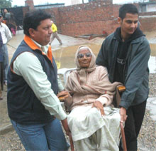 An old woman at a polling booth