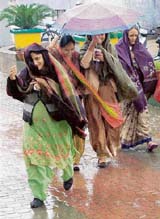 Voters brave rain to cast vote at a polling booth in  Phase VI, Mohali, on Tuesday
