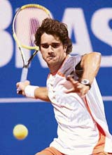 Brazils Thiago Alves returns the ball to Spanish Carlos Moya during their Brazil Open 2007 first round match in Costa do Sauipe, Brazil