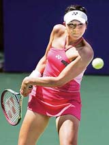 Japans Yurica Sema plays a shot against Ukraines Yuliana Fedak during the first round match of the Bangalore Open