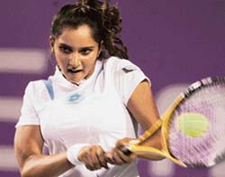 Sania Mirza plays a shot against Slovakias Martina Sucha during the first round match of the Bangalore Open on Wednesday. Sania won 6-4, 4-6, 6-3. 