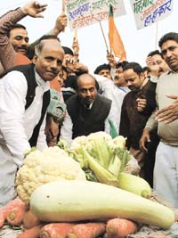 BJP senior leader Vijay Goel with the party activists during the rally against the price hike at Red Fort