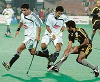 Players of Chandigarh Dynamos and Maratha Warriors in action during a Premier Hockey League match at the Sector 42 Stadium in Chandigarh 