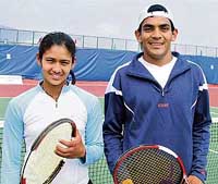 Parul Goswami from Delhi (left), winner of the womens singles tennis title, and Divij Saran, also from Delhi, winner of the men's singles tennis title