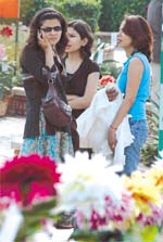 People admiring flowers on the last day of the ongoing 20th Garden Tourism Festival in the Capital on Sunday.