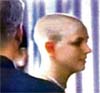 This image taken from a KABC Television broadcast shows singer Britney Spears after attending a beauty salon in Los Angeles, where she reportedly cut off all her hair. .