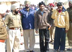 The police exhume the body of Harpreet Singh at Sidhwan village in the presence of two accused Manvinder and Mukhtiar on Monday