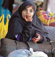 A Pakistani girl pensively awaits departure at the Attari railway station.