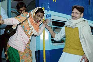 One of the passengers helping a lady get down from the ill-fated Attari Express in Amritsar. 