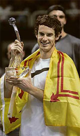 Scotlands Andy Murray holds the trophy after defeating Croatias Ivo Karlovic in the final of the SAP Tennis Open in San Jose, California