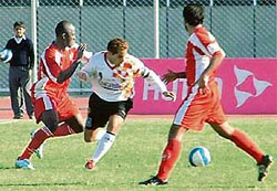 East Bengal skipper Alvito D Cunha (centre) tries to get past JCTs Adebayo Tokunbo (left) in the 11th National Football League at Ludhianas Guru Nanak Stadium 