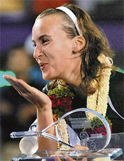 Russias Yaroslava Shvedova acknowledges the crowd after beating Italys Mara Santangalo in the final of the Bangalore Open tennis tournament 