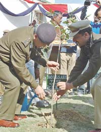 Commissioner of Delhi Police K.K. Paul planting a sapling during the inaugration of a new building of Inder Puri police station in the Capital