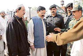 BSF officials receive relatives of the victims of the Samjhauta Express at the Wagah joint checkpost