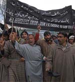 Kashmiris protest against the demolition of residential houses by the state government near the Dal Lake in Srinagar on Monday.