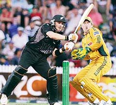 New Zealands Brendon McCullum plays a hook as Australian wicketkeeper Brad Haddin looks on during the third match of the Chappell-Hadlee series at Seddon Park in Hamilton
