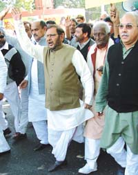 Sharad Yadev, president of the Janata Dal (U) with other leaders shouting slogans against the UPA Government on the issue of price rise at Jantar Mantar in the Capital