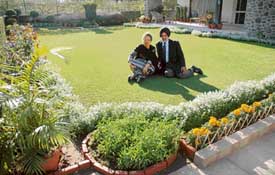 Blooming amidst flowers: Harmohan Singh Sethi and his wife Abnash Sethi in their Sector 21 lawn in Chandigarh on Thursday