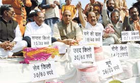 BJP national president with Delhi leaders sitting on dharna with the party activists during a rally against the UPA Government on the issue of price rise in the Capital on Thursday. 