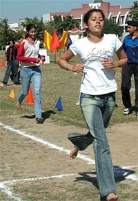 Gagandeep crosses the finishing line in the second heat of 200 mts during the annual athletic meet of Layalpur Khalsa college in Jalandhar