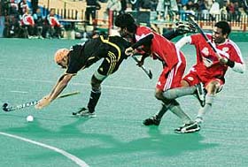 Prabhjot Singh (left) of Chandigarh Dynamos loses his balance after a collision during the PHL match against Hyderabad Sultans at the Sector 42 Hockey Stadium in Chandigarh