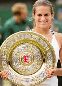 Amelie Mauresmo holds the Wimbledon trophy after winning the womens singles title on July 8, 2006