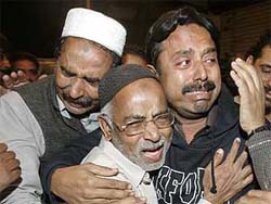 Relatives mourn during the funeral procession of victims of the Samjhauta Express blasts in Karachi on Thursday. 