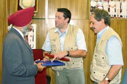 Leader of the French delegation Christophe de Quidt presents a book to PAU vice-chancellor K.S. Aulakh during its visit to the PAU