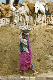 An woman labourer carries stones at a construction site in New Delhi. India has become the major supplier of stone slabs to China’s booming construction industry, which is thriving as a result of high growth in real estate and other sectors