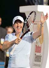 Justine Henin of Belgium rejoices after beating Russias Svetlana Kuznetsova in the semifinal of the Dubai Duty-Free Open tennis tournament on Friday