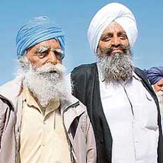 Angrej Singh, visually impaired brother of Sukhdev Singh Babbar, slain chief of the Babbar Khalsa, and his cousin Harbans Singh on their way to the polling station in Dassuwal on Saturday.