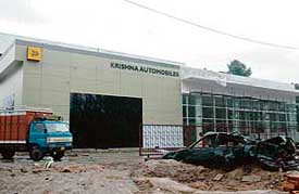 The owner of an industrial plot No.125, who applied for conversion of his plot into a car showroom under the conversion policy, is till waiting for the sanctioning of the building plans. Work on the showroom is in final stages.
