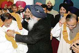 Overjoyed on his election as leader of the SAD-BJP legislature group in Chandigarh on Wednesday, Parkash Singh Badal garlands BJP senior leader Vankaiah Naidu and Arun Jaitlay while others celebrate the moment.