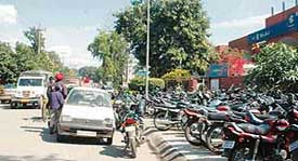Haphazardly parked vehicles leave little space for movement in the Industrial Area in Chandigarh