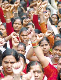 Activists of the Hind Mazdoor Sabha listening raise slogans against the governements inability to check the increasing rate of unemployment at a rally in the Capital on Thursday