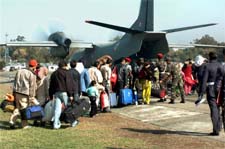 Stranded passengers board the aircraft at the technical airport in Jammu on Thursday.