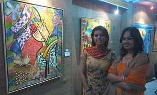 The first and second prize winners of painting, Esha Chadha (left) and Jasreen Kathuria, respectively, with the 1st prize winning painting at Apeejay College of Fine Arts in Jalandhar on Thursday.