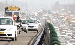 Traffic runs smoothly on the Delhi-Gurgaon Expressway flyover at IFFCO Chowk in Gurgaon