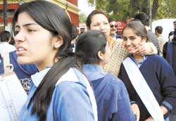 Students and parents sport a relaxed look after the Class X exams, which began on Friday, outside the examination centre in the Capital. 