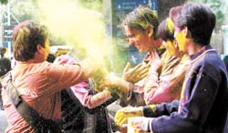 Holi Hai: YMCA students applying colours on one another on the eve of Holi