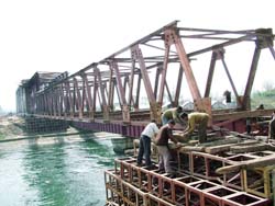 The construction of the bridge on the Mukerian hydel channel near Uchhi Bassi village in Hoshiarpur district on the Jalandhar-Pathankot rail section