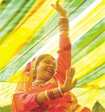 A folk dancer performing during the International Womens Day celebrations at Dilli Haat on Thursday