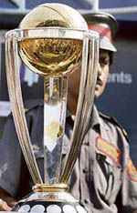 A security guard stands beside the ICC World Cup trophy in Kolkata on Thursday. The trophy will be flown to the West Indies.