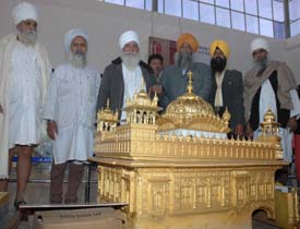 A model of the Golden Temple being installed at Rajasansi International Airport. 
