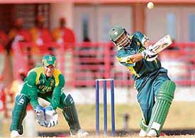 Pakistans Younis Khan plays a shot as South African wicketkeeper Mark Boucher looks on during the World Cup warm-up match in Port of Spain on Friday