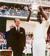 Clive Lloyd holds aloft the 1975 World Cup trophy. He also led the West Indies to victory in the 1979 edition
